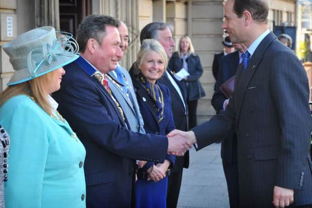 HRH Prince Edward the Earl of Wessex visited County Hall in Preston to accept a minibus on behalf of the Duke of Edinburgh Award Scheme. The earl greets the Mayor and Mayoress of Preston Councillor Nick and Barbara Pomfret.