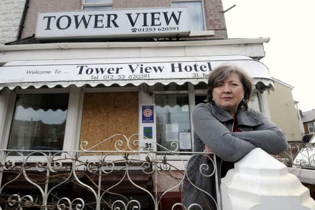 Jennifer McGirr from the Tower View Hotel was shocked to fiind a brick through her window on Friday