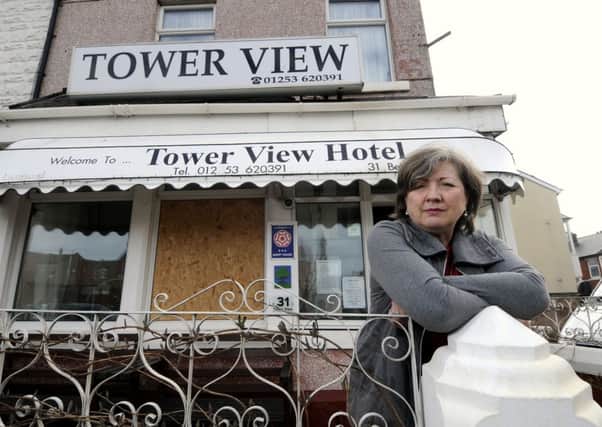 Jennifer McGirr from the Tower View Hotel was shocked to fiind a brick through her window on Friday