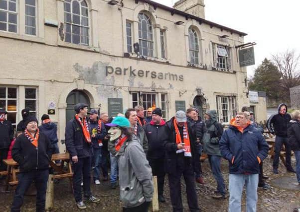Protestors gather outside the Parkers Arms pub