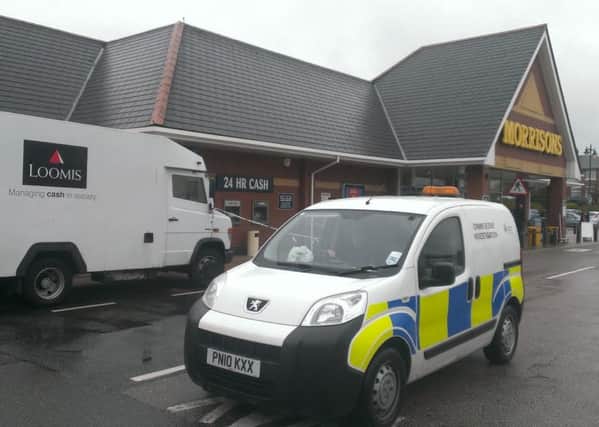 Police at the scene of an alleged robbery at Morrisons, Kirkham
