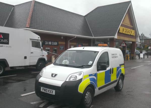 Police at the scene of alleged robbery at Morrisons, Kirkham