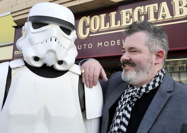 Mark Yates the owner of Brooks Collectables, Blackpool with a Star Wars Stormtrooper