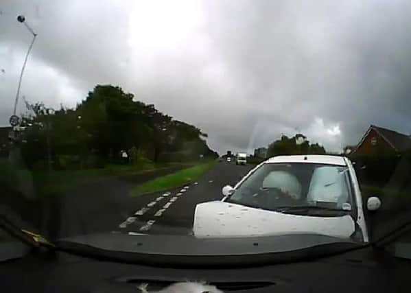 SMASH: Stills from his film of the car driving at his vehicle