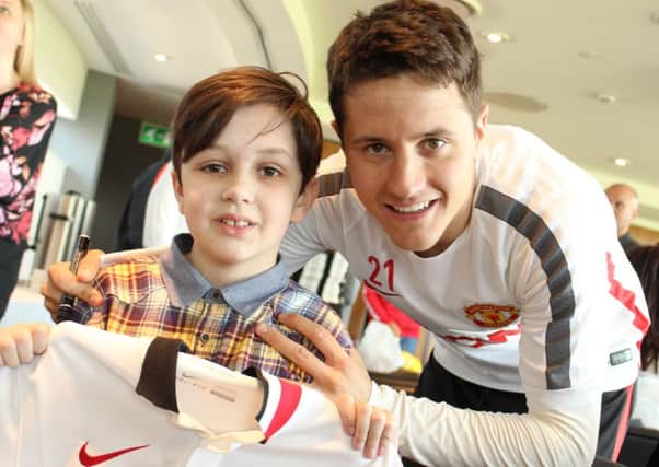 Louis, 11, with Ander Herrera during the Manchester United Foundation Dream Day at Aon Training Complex