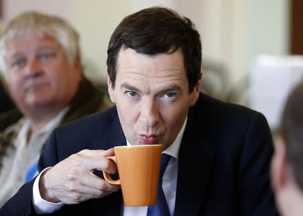 Chancellor George Osborne during a visit to New Yorker Sundaes Ice Cream Parlour in Cleveleys while on the General Election campaign trail. Photo: Peter Byrne/PA Wire