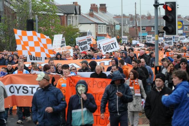 Supporters protest outside Bloomfield Road before the match