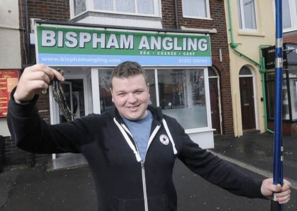 Jordan Russell with some of his blackworms outside his expanded business Bispham Angling