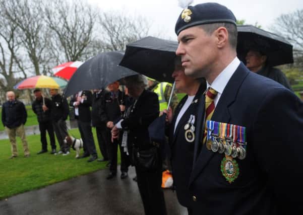 Wreath laying ceremony at the war memorial in Ashton Gardens to mark VE Day
