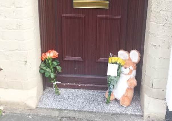 Flowers left at the scene of 
Freddie Neils death