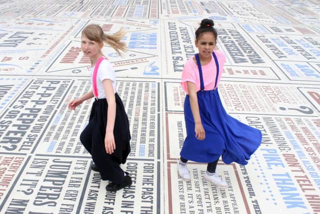 More than 1,000 Northern Soul fans descended on the Comedy Carpet infront of Blackpool's Tower to set a world record for the most dancers in one outside event and raise money for Cancer Research. 
Pictured are Sandra Jaskowiak and Ayisha Clemence both aged 11.
