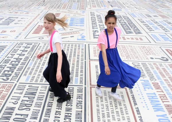 More than 1,000 Northern Soul fans descended on the Comedy Carpet infront of Blackpool's Tower to set a world record for the most dancers in one outside event and raise money for Cancer Research. 
Pictured are Sandra Jaskowiak and Ayisha Clemence both aged 11.