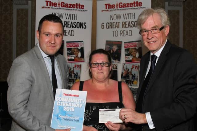 Community Giveaway 2015  by Swallowdale Children's Turst in association with The Blackpool Gazette at The Imperial Hotel.Pictured is Gazette Deputy Editor Andy Sykes and Chairman of Swallowdale CHildren's Trust with Community Giveaway Winner Billy King.