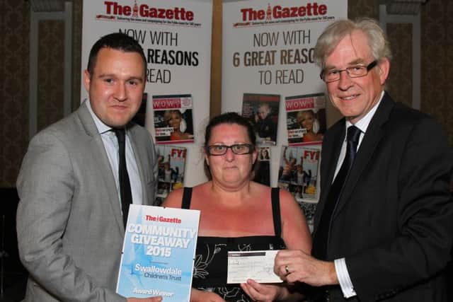 Community Giveaway 2015  by Swallowdale Children's Turst in association with The Blackpool Gazette at The Imperial Hotel.
Pictured is Gazette Deputy Editor Andy Sykes and Chairman of Swallowdale CHildren's Trust with Community Giveaway Winner Billy King.