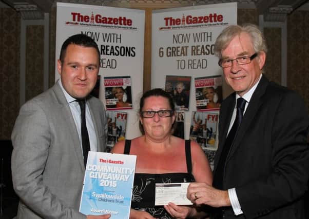 Community Giveaway 2015  by Swallowdale Children's Turst in association with The Blackpool Gazette at The Imperial Hotel.
Pictured is Gazette Deputy Editor Andy Sykes and Chairman of Swallowdale CHildren's Trust with Community Giveaway Winner Billy King.