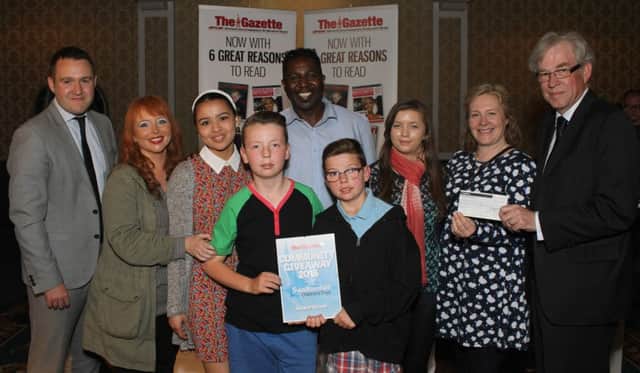 Community Giveaway 2015  by Swallowdale Children's Turst in association with The Blackpool Gazette at The Imperial Hotel.
Pictured is Gazette Deputy Editor Andy Sykes and Chairman of Swallowdale CHildren's Trust with Community Giveaway Winners Streetwise Youth Club.
4th June 2015