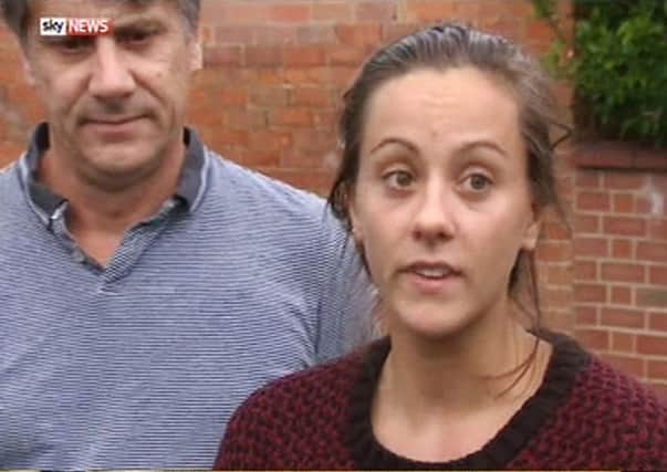 Eleanor Hawkins with her father Timothy as she made a statement outside her family home in Draycott, Derbyshire, apologising for any offence she caused by stripping on a Malaysian mountain which is considered sacred Picture SKY NEWS
