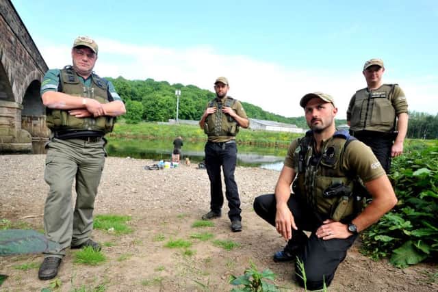 Environment Agency fish bailiffs Neil Handy, Mark Rudd, Darren Wilson and Damien Linney checking fishermen along the River Ribble in Preston