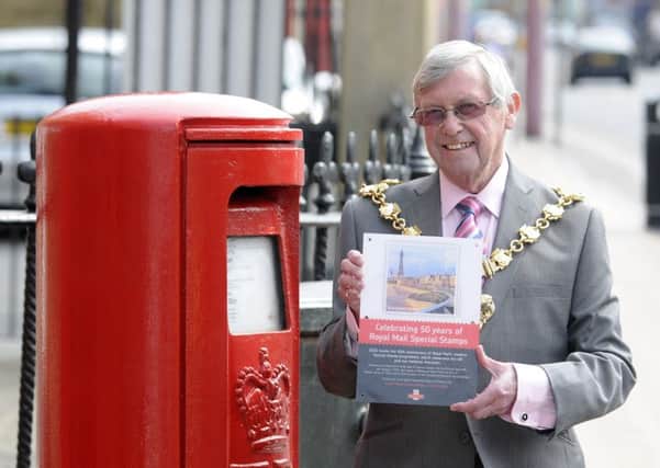 Blackpool Mayor Coun Peter Callow with the Royal Mail plaque which he unveiled in Talbot Square