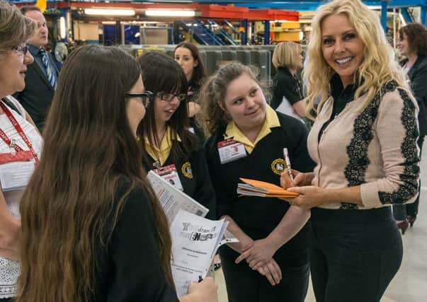 Former Countdown star Carol Vorderman with the students at BAE Warton yesterday