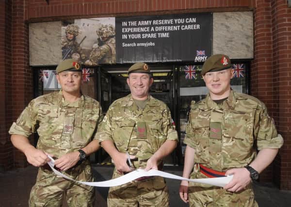 Cpl Dan Pinder, Sgt Joe Cork and Cpl Ollie Gillibrand from 4Lancs open up the new army store at the Houndshill