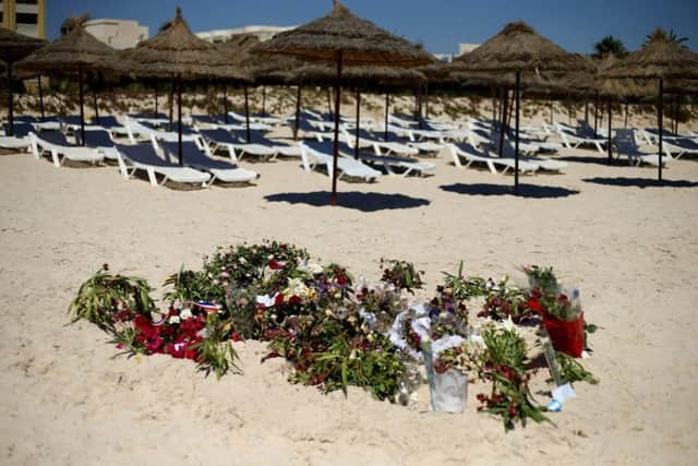 Flowers on the beach near the RIU Imperial Marhaba hotel in Sousse, Tunisia, as British holidaymakers defy the terrorists and continue to stay in Sousse despite the bloodbath on the beach