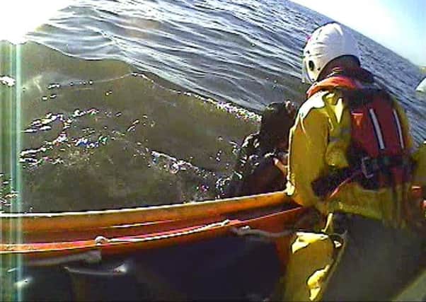 Blackpools RNLI crew pluck a woman from the sea in North Shore