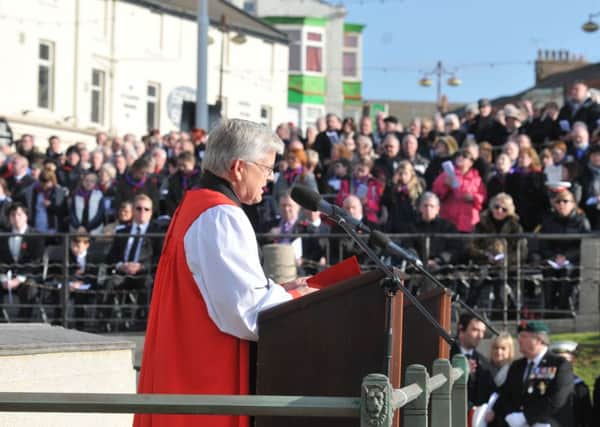 Opposed: The Bishop of Blackburn, the Rt Rev Julian Henderson, on Remembrance Sunday in Blackpool