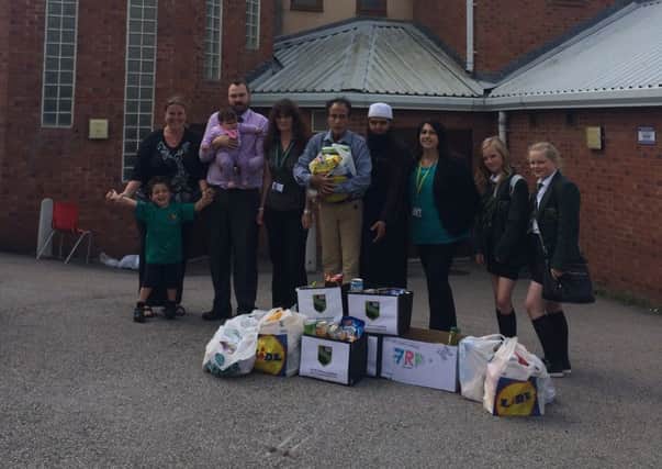 South Shore Academy gives food donations to Revoe Mosque and Blackpool Food Bank.  Pictured are Alia and Noah Soleman, Matthew Hall, Helen Clark, Lisa Gates, Maulana Patel, Emma Greenwood, Denise Swinscoe and Chelsea Goodman