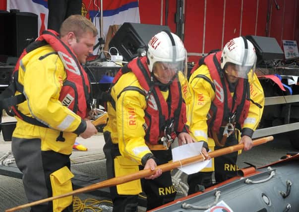 Some of the lifeboat crew play a full-size version of the RNLI's new fundraising game