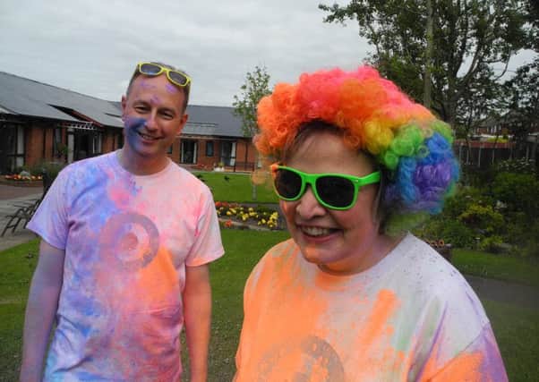 Trinity Hospice chief exec David Houston and medical director Dr Susan Salt bravely agreed to be used as target practise ahead of the Colour Splash fundraising event