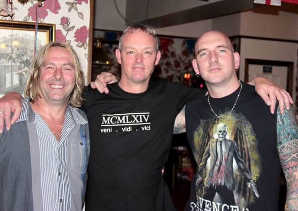 Mark Taylor, centre, with Fluid Rock members Chris Hunt and James Stringfellow