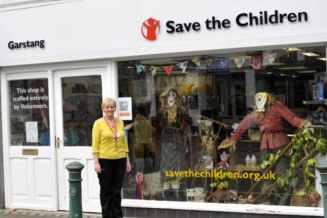 Karen Newton with Save The Childrens display