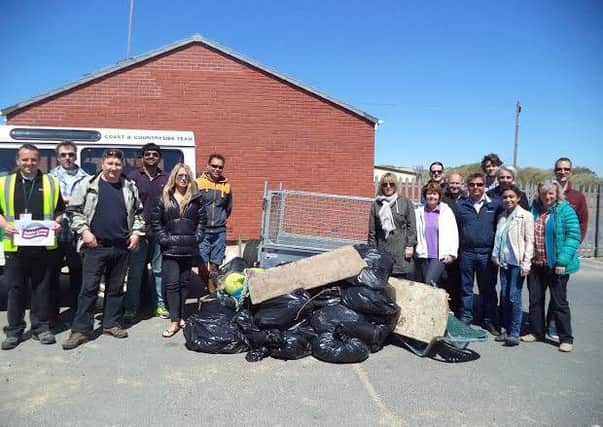 Volunteers from Axa Insurance on a litter pick near St Annes beach as part of the Fylde Litter Action Group