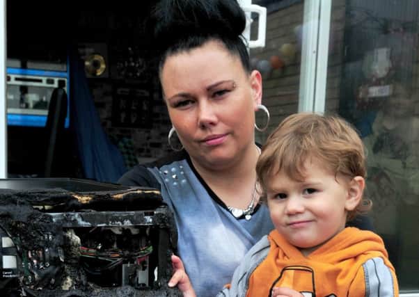 Photo: David Hurst
Becky Towne with her son Elliott of Chatsworth Avenue, Fleetwood, who saved the family house when he raised the alarm after the family washing machine set on fire.