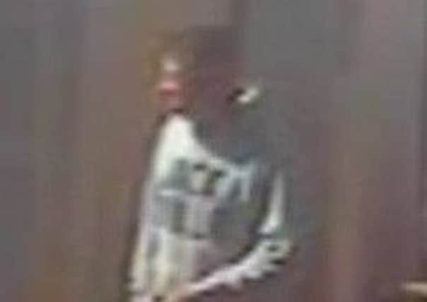 CCTV image of a man police want to speak to after a purse was stolen from a pram in St Annes.