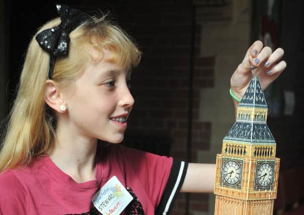 The annual St Annes Jigsaw Festival began today in the United Reformed Church.
12 year-old Felicity Heavyside tackles a three-dimensional puzzle of the Houses of Westminster clock tower.  PIC BY ROB LOCK
18-8-2015