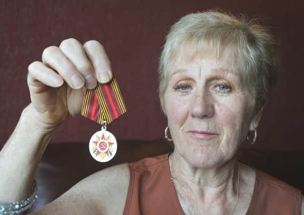 Estelle Drummond, pictured with the medal she has received from the Russian Embassy, is delighted that her late father Wilfred Robertson has finally been recognised for his part in the Second World War Arctic convoys