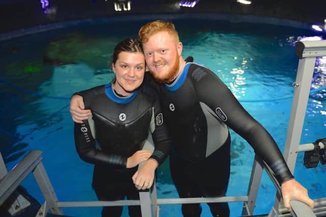 © WARREN SMITH 2015SUBMIT PIC.                                                                                                              06/09/15Marriage Proposal on The Sea Bed!Joiner Tom Seaton surprised his girlfriend Eve Ramsay when he popped the question on Saturday in a fish tank&at Sea Life Manchester watched by a giant sea turtle, sharks and other sea creatures.( PICTURED HERE JUST AFTER)The two 21-year-olds from Humberside have been deeply in love since they met four years ago at Tollbar Sixth Form College in Waltham near Cleethorpes.Earlier this year they enjoyed a thrilling snorkelling holiday in Thailand, and that gave Tom the idea for a proposal with a difference.And with help from the staff at Manchester Sea Life Centre, he was able to ask for Eves hand in marriage while the couple walked on the bed of the Centres mighty ocean tank.Tom held up signs reading: There are plenty of fish in the sea but youre the one for me, and Will you marry me?He then produced the ring from inside a larg