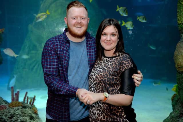 © WARREN SMITH 2015SUBMIT PIC.                                                                                                              06/09/15Marriage Proposal on The Sea Bed!Joiner Tom Seaton surprised his girlfriend Eve Ramsay when he popped the question on Saturday in a fish tank&at Sea Life Manchester watched by a giant sea turtle, sharks and other sea creatures.The two 21-year-olds from Humberside have been deeply in love since they met four years ago at Tollbar Sixth Form College in Waltham near Cleethorpes.Earlier this year they enjoyed a thrilling snorkelling holiday in Thailand, and that gave Tom the idea for a proposal with a difference.And with help from the staff at Manchester Sea Life Centre, he was able to ask for Eves hand in marriage while the couple walked on the bed of the Centres mighty ocean tank.Tom held up signs reading: There are plenty of fish in the sea but youre the one for me, and Will you marry me?He then produced the ring from inside a large model shark egg, or Merm