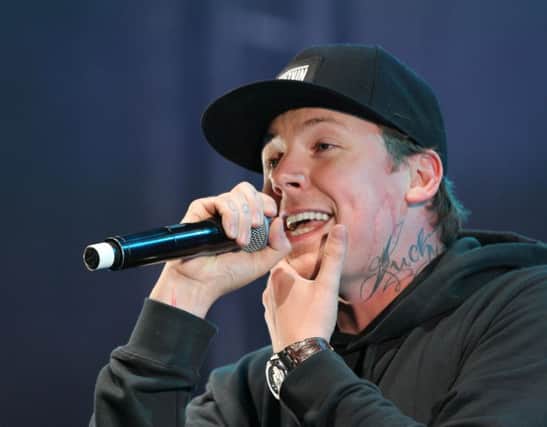 Pictured is Professor Green performing on stage.