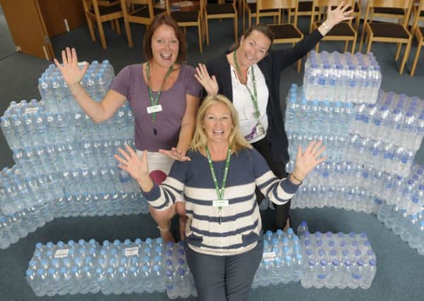 Trinity Hospice have been donated bottled water by schools who no longer need it.  Pictured are Sarah Giannone, Lisa Martin and Deborah Hough.