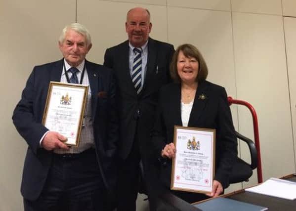 Frank Shipway (centre) presents certificates to retiring magistrates David Jesson and Christine Fitton