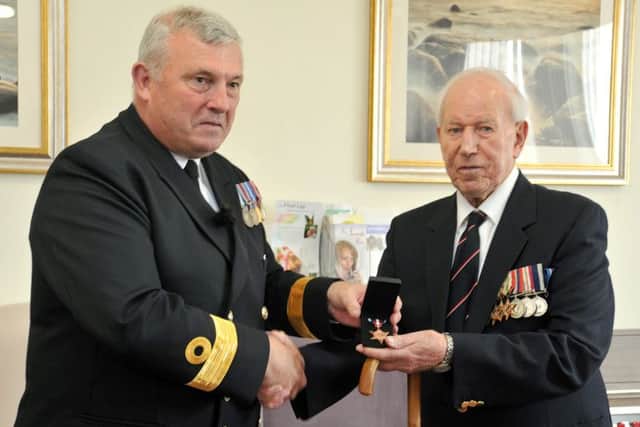 Former sailor John Johnstone was officially presented with his Arctic Star medal by Commodore Gary Doyle during a ceremony at Starr Hills Residential Home in Ansdell.
Commodore Doyle presents the medal.  PIC BY ROB LOCK
17-9-2015