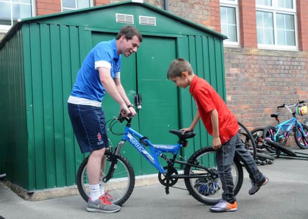 Tom Hutton with St Thomas pupil Ben Cobban at a recent bike coding event