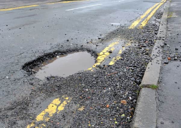 Large potholes causing danger to motorists and cyclists
