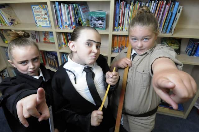 Children and teachers from Royles Brook Primary School dress up as Roald Dahl characters and mark the opening of their new library.  Alix Farmer, Molly Wilkinson and Abbi Addison.