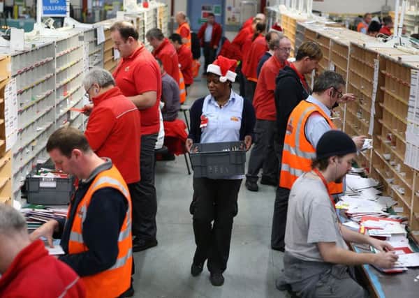 Staff at Royal Mail's Glasgow mail centre, as Royal Mail has announced plans to recruit 19,000 workers to help deal with the seasonal increase in post and parcels. Photo: Andrew Milligan/PA Wire