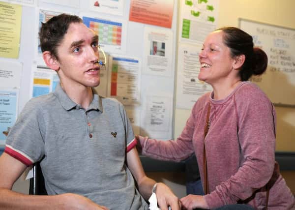 Reece Roberts with mum Milissa Roberts shortly after an operation to have frontal skull bones removed to ease pressure on his brain