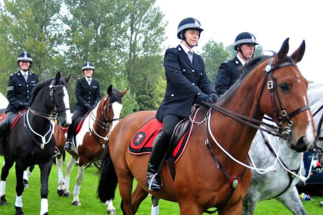 Mounted branch enter thye arena at the 2nd Lancashire Police HQ Open Week-End in Hutton.